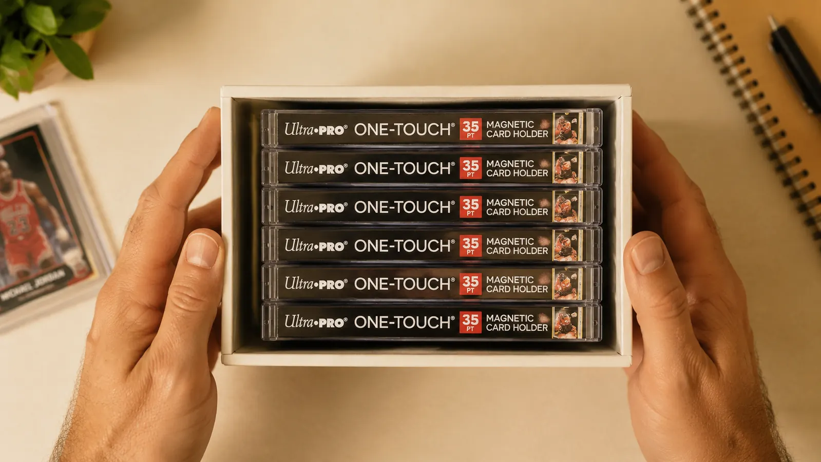 Collection of Ultra Pro One Touch holders stacked neatly in a card storage box showing how they organize without bulk